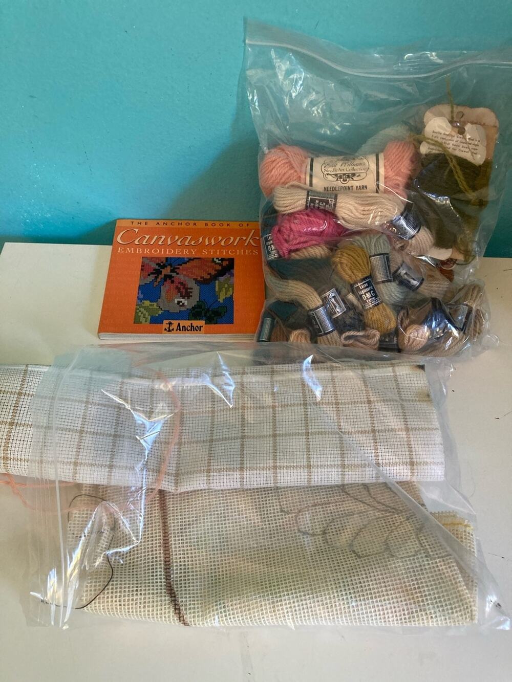 Embroidery Package includes Book, Misc Yarn, practice grid and needle